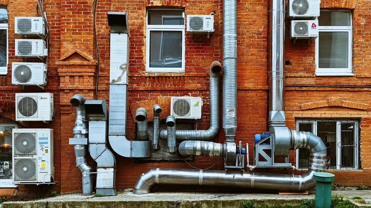 a building with a bunch of pipes on the side of it